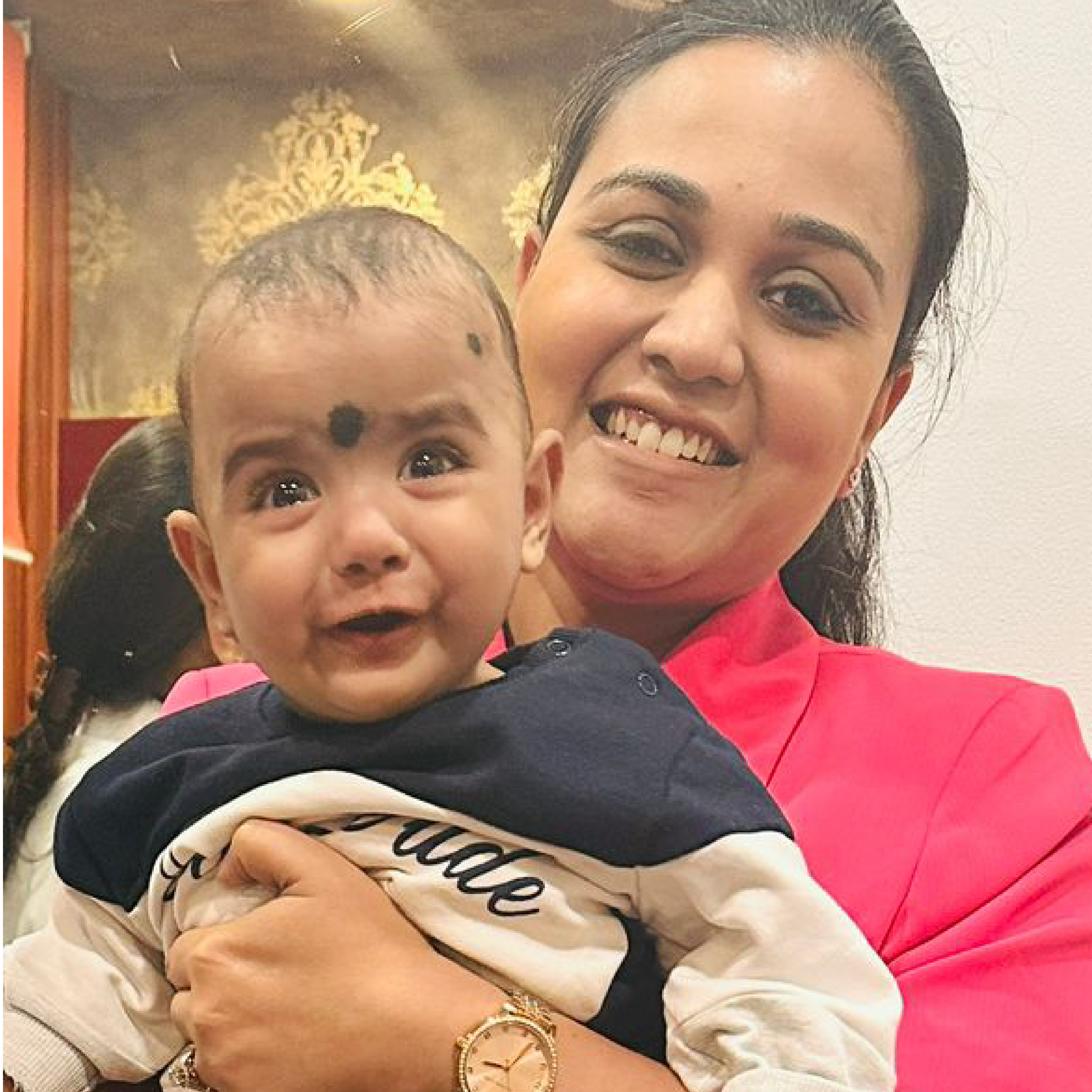 HomeIVF specialist handing over a newborn baby to the parents after a successful IVF cycle
