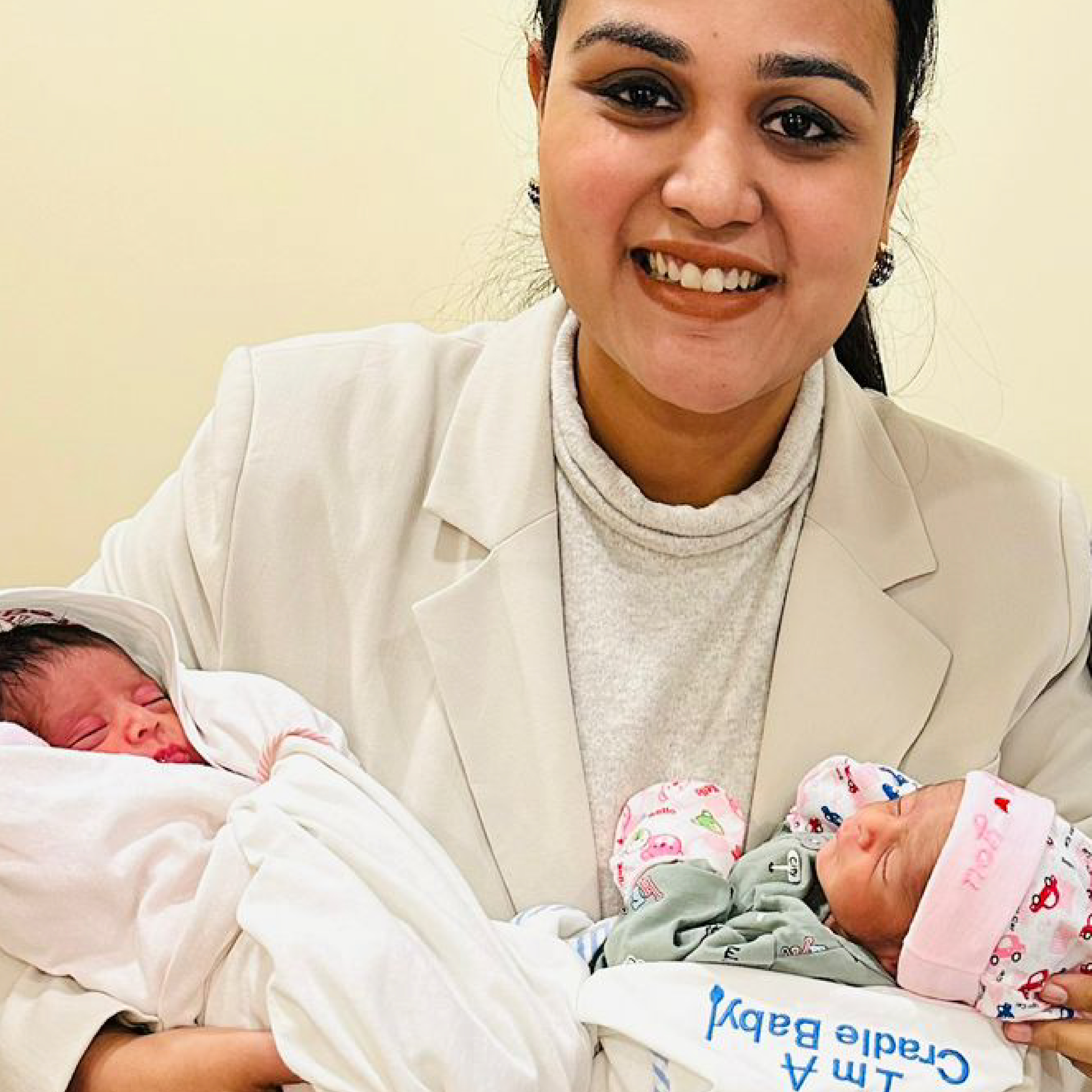 Family celebrating a HomeIVF newborn baby with the fertility team on delivery day